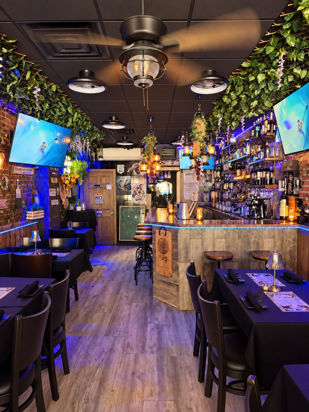 The bar and tables at Klan Destino in Queens